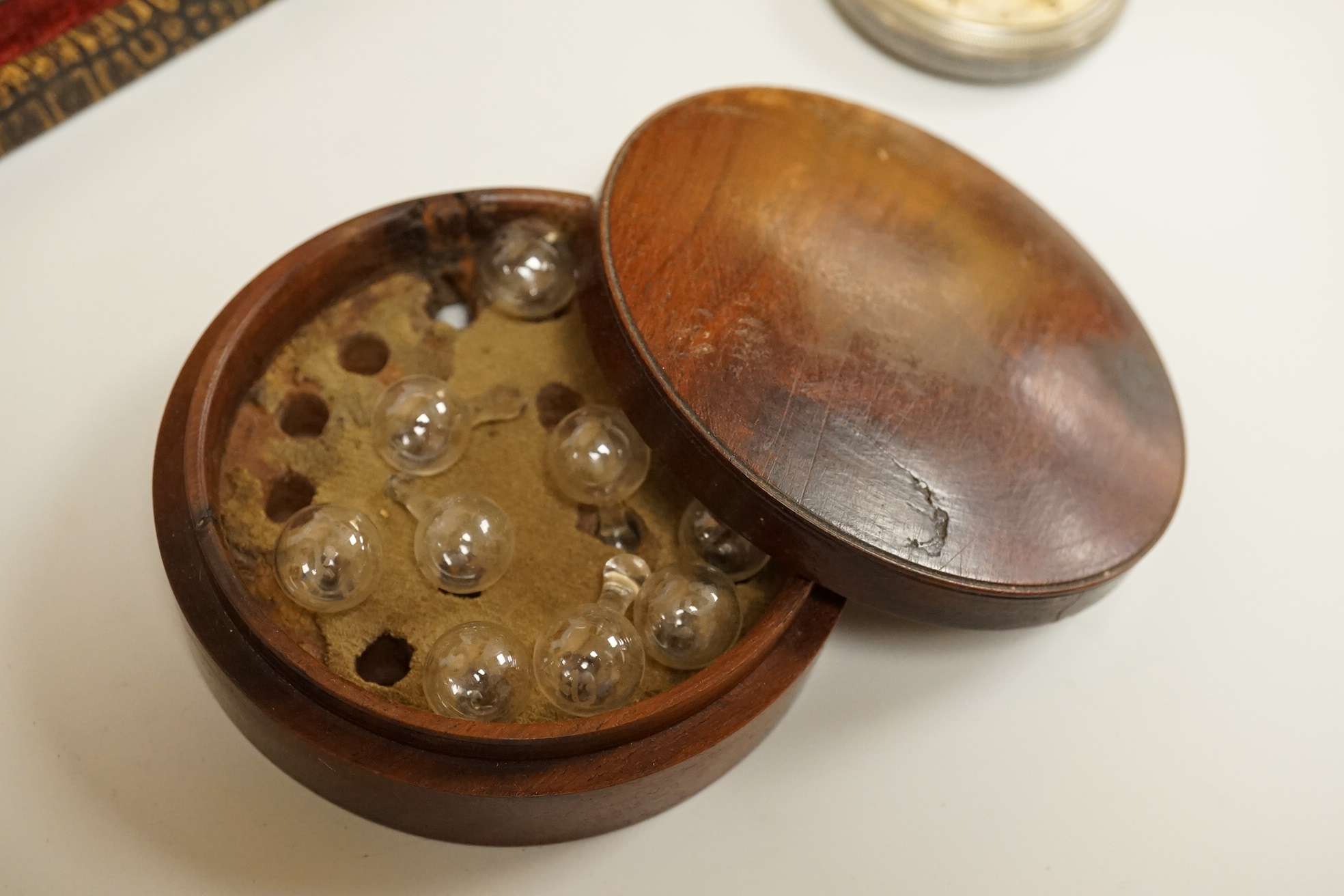 A cased set of semi-precious handled butter knives, two Chinese pottery teapots, a stoneware box and a figure, etc.